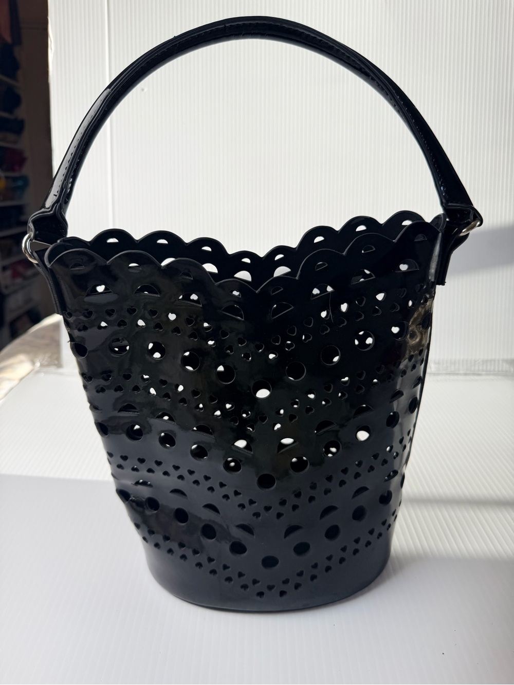 Neumann Marcus cut bucket bag with heart and circle cut out